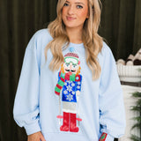 Powder Blue Skiing Nutcracker Sweatshirt | Queen Of Sparkles