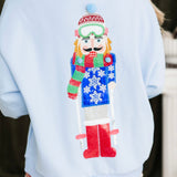 Powder Blue Skiing Nutcracker Sweatshirt | Queen Of Sparkles