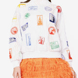 White Multi Passport Stamp Mock Neck Sweatshirt | Queen Of Sparkles