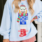 Powder Blue Skiing Nutcracker Sweatshirt | Queen Of Sparkles