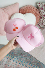 COQUETTE BOW EMBROIDERED TRUCKER HAT