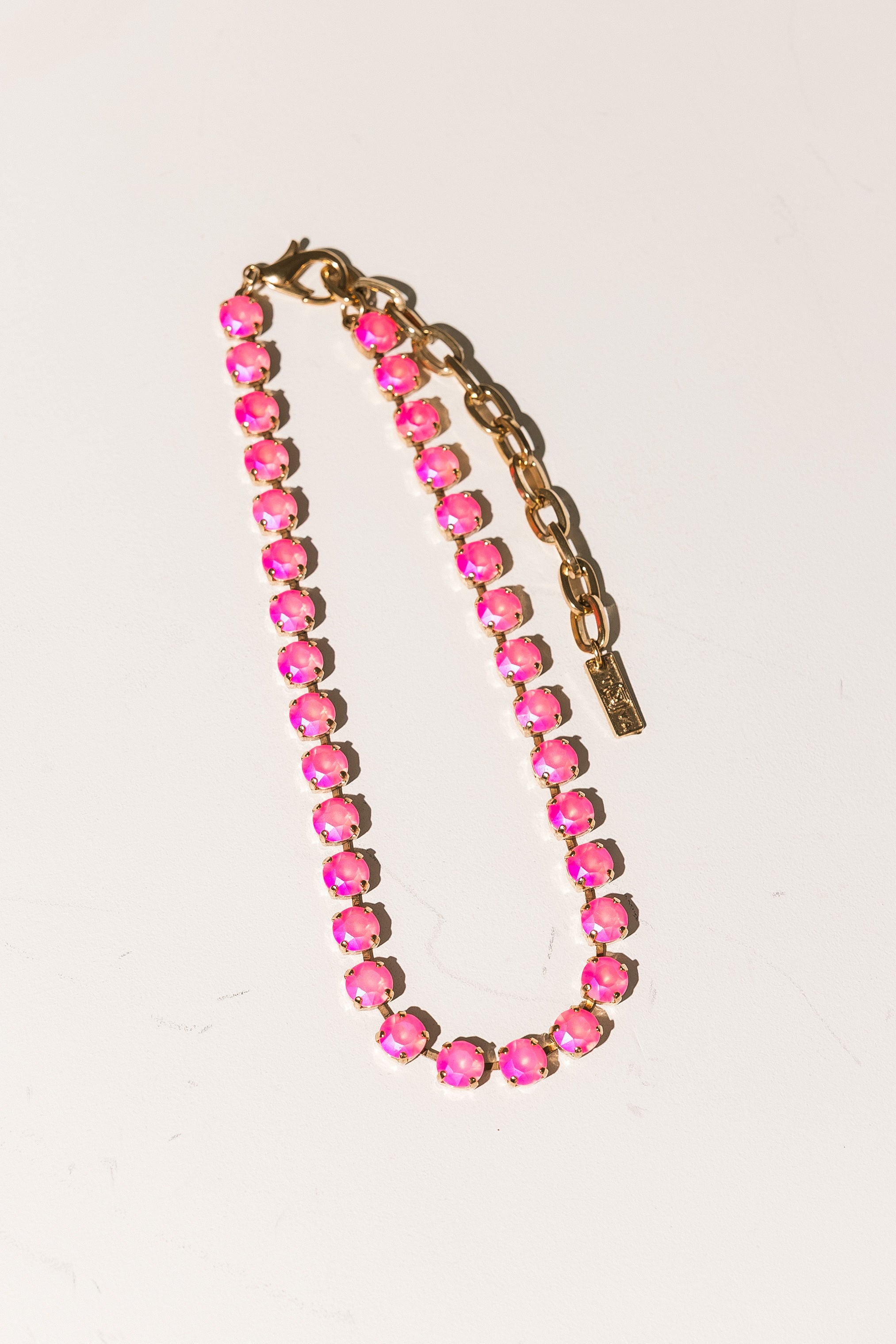 TOVA Oakland Necklace in Electric Pink Ignite Frost – detail view of electric pink crystal necklace