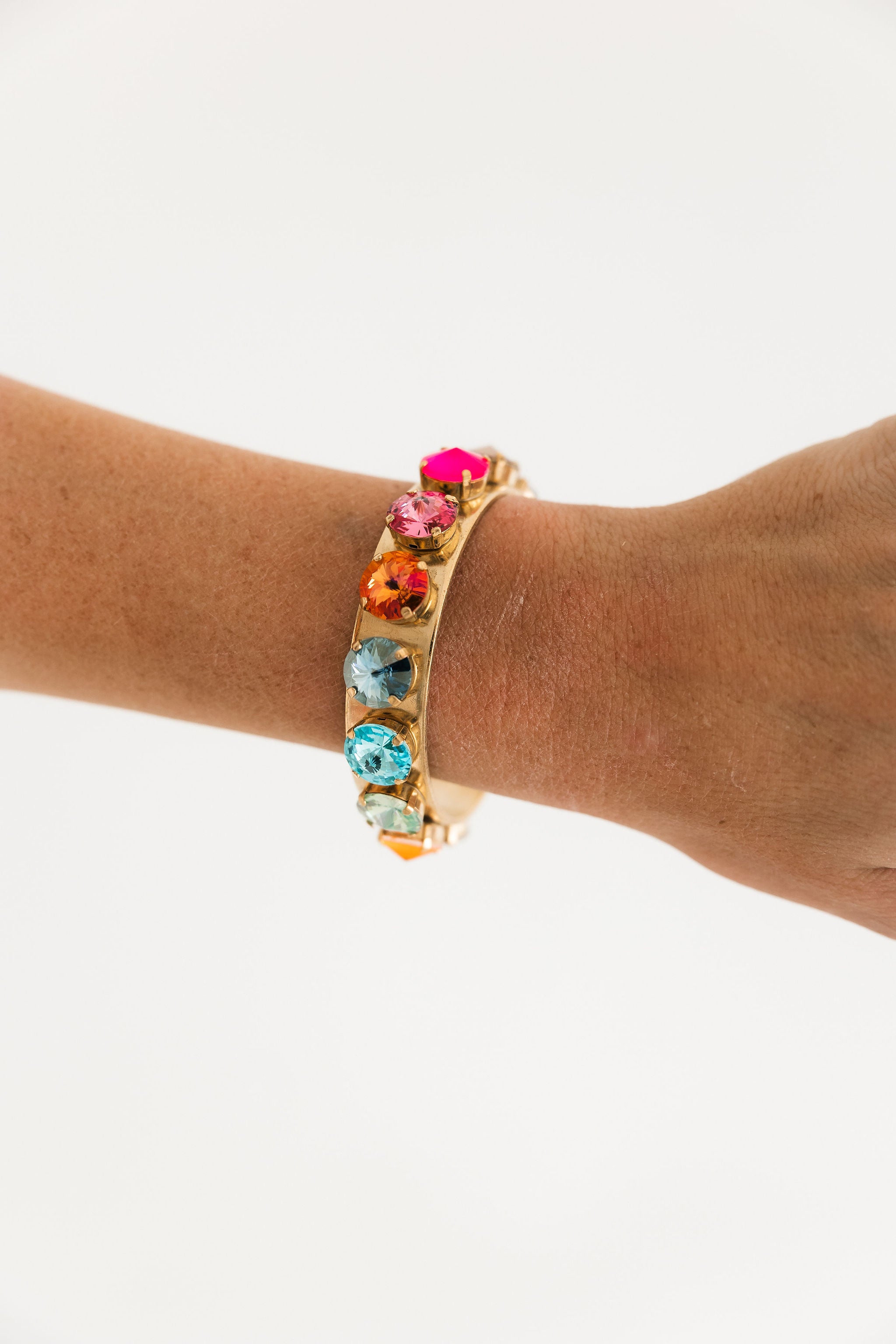 TOVA Keira Cuff in Watermelon Rainbow worn on wrist – multicolor crystal cuff bracelet from Lexi Jade's Boutique
