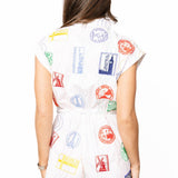 White Multi Stamp Zip Up Romper | Queen Of Sparkles